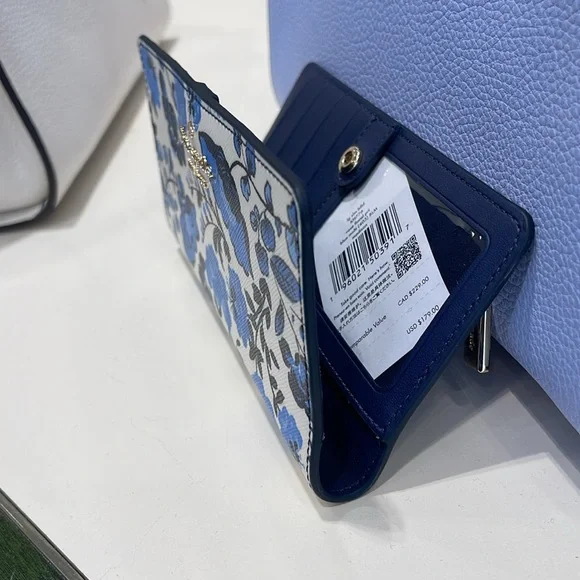 Kate Spade Madison Vase Floral Large Slim Bifold Wallet
Blue Multi
NWT - Picture 10 of 16